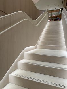 a set of white stairs leading up to a building