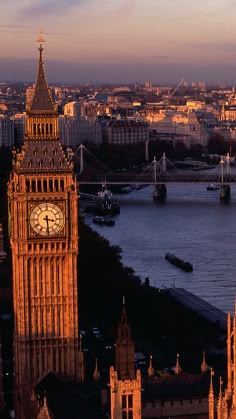 the big ben clock tower towering over the city of london, england at sunset or dawn