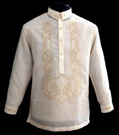 Keep it sharp and streamlined in this Piña-Jusi Barong Tagalog. Expertly made in our Jusi fabric with Chinese collar and hand-embroidery Color: Beige Traditional collar, cuff buttons Classic Formal fit Fully Lined Return or Exchange Policy: You may return or exchange the items within 10 days (the 10 days starts from the day you receive the order.) All claims MUST be made within 3 days upon receiving the order. Shipping charges will not be refunded. Returned products must be in absolutely new and Formal Fitted Tops With Embroidered Cuffs, Formal Festive Embroidered Shirt, Festive Formal Embroidered Shirt, Elegant Embroidered Shirt For Festive Occasions, Formal Long Sleeve Blouse With Embroidered Cuffs, Elegant Festive Embroidered Shirt, Traditional Embroidered Shirt For Formal Occasions, Traditional Long Sleeve Kurta With Embroidered Cuffs, Fitted Long Sleeve Kurta With Embroidered Cuffs