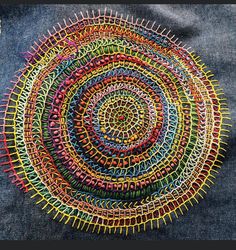 a multicolored piece of art made out of jeans