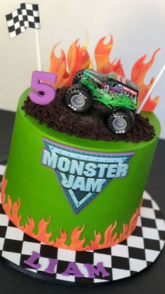 a monster truck birthday cake with flames on top