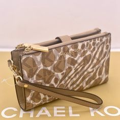 Brand New With Tag Michael Kors Large Double Zip Wristlet Camel Multi Color Wallet, Clutch, 7-8 Pvc And Leather Inside Gold Tone Hardware 6 Credit Card Holders 1 Id Holder 2 Slip Compartments 2 Zip Pockets A Phone Holder Slot And A Large Bill Section Accessible From The Side 7.25" 4.25" 1" Comes With A Detachable Wrist Strap Michael Kors Beige Rectangular Wallet, Gold Wristlet For Travel, Cream Wallets With Zipper Closure, Micheal Kors Wallet, Soft Gloves, Credit Card Holders, Michael Kors Clutch, Michael Kors Wristlet, Brown Leather Wallet