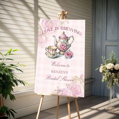 an easel with a sign that says, love is brewing welcome to kaylen's bridal manor