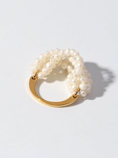 Experience the charm of our handcrafted Woven Multi-Layer Freshwater Pearl Ring. Its intricate woven design showcases expert craftsmanship and timeless elegance. Each natural pearl adds a unique luster and texture to the ring, while the multi-layered weave creates depth and sophistication. Metal: 18K Recycled Gold Plated On Brass Gemstone: Freshwater Pearl Ring Sizes Available: US 6, 7, 8 Layered Weave, Woven Ring, Freshwater Pearl Ring, Smokey Quartz, Recycled Gold, Swarovski Pearls, Keep Jewelry, Exquisite Jewelry, Gold Filled Jewelry