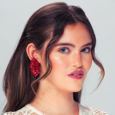 Make a statement with our Red Crystal Wing Earrings! Handcrafted by skilled artisans, these stunning statement earrings feature shimmering red crystals and a unique winged design. Lightweight and comfortable, they're perfect for adding a touch of elegance to any outfit. Ideal for both casual and formal occasions, these earrings exude quality and beauty. Elevate your style and feel confident with our exceptional Red Crystal Wing Earrings, and let the world admire your breathtaking beauty! Size: L Red Drop Earrings For Party, Red Clip-on Earrings For Evening, Red Single Earring For Evening, Red Beaded Earrings For Party, Red Drop Clip-on Earrings For Party, Red Drop Crystal Earrings For Evening, Red Crystal Earrings For Evening, Red Drop Earrings For Evening, Red Crystal Glamorous Earrings