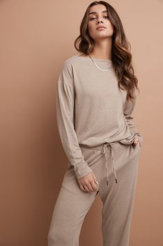 You’re a smart dresser, and you want pieces that serve more than one purpose. This beautiful, minimal top is it. The style perfectly transitions from casual-comfort to workplace-ready, depending on your mood. It’s fashioned with an elegant boat neckline for a modern yet modest sensibility and has a snug fit that flatters while never feeling too tight or uncomfortable. But what you’ll love most of all is its ease-of-wear: style it with a favourite Rekucci jean or pair it with its matching bottom Versatile Knit Sweater For Loungewear, Casual Long Sleeve Top For Loungewear, Casual Long Sleeve Solid Color Top For Loungewear, Versatile Long Sleeve Knit Top, Effortless Beige Tops For Loungewear, Versatile Relaxed Fit Long Sleeve Top For Everyday, Versatile Soft Knit Sweater For Loungewear, Versatile Soft Knit Sweater, Solid Fine Knit Sweater For Loungewear