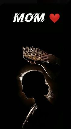 a woman holding a crown in her hand with the word mom on it and a heart above