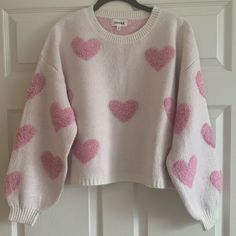 Soft And Fun Pink Heart Sweater - Nwt 500+ Listings Already Sold, 300+ Listings Still Available! Everything Must Go - Bundle To Save - All Offers Accepted Or Countered! White Heart Print Sweater For Winter, White Heart Sweater For Winter, White Heart-shaped Sweater For Spring, White Trendy Sweater With Heart Print, Trendy White Sweater With Heart Print, Winter White Tops With Heart Print, White Heart Print Tops For Winter, Pink Heart Sweater, Big Rangoli