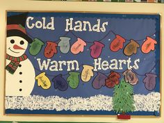 a bulletin board with a snowman and mittens hanging from it's sides