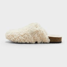 Comfy, cute and cozy, these Faux-Shearling Loafer Slippers from Cat & Jack™ add sweet style to your child's wardrobe. In a soft ivory hue, these slippers are made with plush faux shearling and a contoured footbed for all-day comfort. A closed-toe upper accented with a gold-tone buckle, plus slip-on style, complete the look. Cat & Jack™: Designed for all children so you can trust it's made for yours. Soft Cream Round Toe Slippers, Faux Fur Slippers With Round Toe For Fall, Winter Cream Closed Toe Slippers, Construction For Kids, Clog Slippers, Loafer Slippers, Clog Sandals, 5 Kids, Sweet Style