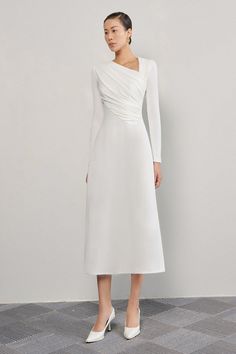 The unique lopsided A-line design and crinkle crepe fabric create a stunning silhouette, while the long sleeves add a touch of sophistication. Perfect for any occasion, this dress exudes luxury and refinement. White Grad Dress Long, Elegant White Dress Classy Chic, Crepe Dress Classy, White Midi Dress Classy, Modest Graduation Outfit, Elegant Dresses Classy Chic, White Long Sleeve Midi Dress, White Grad Dress, Long Sleeve Dress Midi