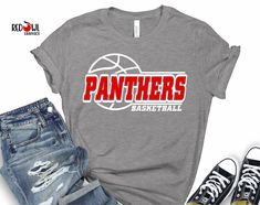 a t - shirt with the word panthers on it next to ripped jeans and sneakers