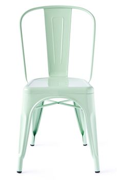 a light green metal chair on a white background with clippings to the back