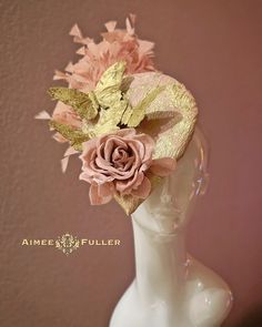 A dreamy color combination featuring gold-feather butterflies and pretty mauve rose. Luxurious brocade Jacquard fabric and a Heavenly feather array on this headband fascinator, perfect for race day or wedding.   Also appropriate for the Kentucky Derby, Kentucky Oaks, weddings, cocktail, high tea, church, holiday parties. and charity luncheons.  *FREE SHIPPING Handmade by Aimee Fuller in Southern California    For more STATEMENT JEWELRY and HANDMADE HATS go to www.aimeefuller.com FIND US ON FACEBOOK: https://www.facebook.com/aimeefullerdesigns/ Gold Wedding Fascinator With Feathers, Gold Fascinator For Garden Party, Gold Fascinator For Kentucky Derby Garden Party, Gold Fascinator For Spring Garden Party, Gold Headpiece For Spring Races, Adjustable Gold Mini Hats For Garden Party, Gold Summer Fascinator For Garden Party, Gold Fascinator For Summer Garden Party, Pink Headpiece For Kentucky Derby Ceremony