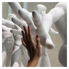 a hand reaching up to a sculpture with the words baby, look what you've done to me