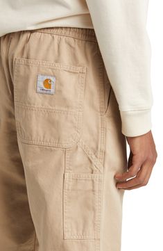 Made from durable organic-cotton twill, these straight-leg pants with an elastic waist are sure to be your everyday go-to. 29 1/2" inseam; 15" leg opening; 15" front rise; 16 1/2" back rise (size Medium) Elastic waist Front slant pockets; back patch pockets 100% organic cotton Dry clean or machine wash, tumble dry Imported Men’s Cargo Pants Styles, Carhartt Pants Outfit, Carhartt Mens Fashion, Mens Cuffed Pants, Mens Hiking Pants, Carhartt Style, Cargo Pants Style, Carhartt Men, Carhartt Pants