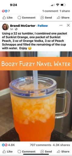 an orange drink with a straw sticking out of it's top and the caption reads boozy fuzzy navel water