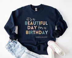 It's a Beautiful Day for a Birthday! This Labor and Delivery sweatshirt is sure to be a big hit everywhere you go. Our cozy crewnecks are perfect for staying warm during rounds in the hospital, or while running errands. Find this design on a TSHIRT: https://www.etsy.com/listing/1416110327/labor-and-delivery-shirt-ld-tshirt-baby?ref=listing_published_alert S I Z I N G: ----------------- These sweatshirts are unisex. Please refer to the size chart prior to ordering. S H I P P I N G & R E TU R N S: ----------------------------------------- These products are made to order and ship out within 5 business days. Because of this, returns cannot be accepted. If your product was damaged during shipment, please contact me. Lost packages: We are not responsible for incorrect delivery addresses, or for Graphic Print Sweatshirt For Birthday And Mother's Day, Mother's Day Birthday Graphic Print Sweatshirt, Birthday Letter Print Relaxed Fit Sweatshirt, Relaxed Fit Letter Print Sweatshirt For Birthday, Mother's Day Birthday Crew Neck Sweatshirt, Baby Nurse, Neonatal Nurse, Nursing Student Gifts, Nursing Baby