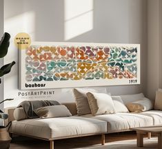 a living room filled with lots of furniture next to a wall mounted art piece on the wall