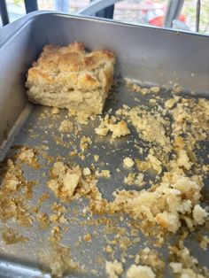 a metal pan filled with food on top of a table