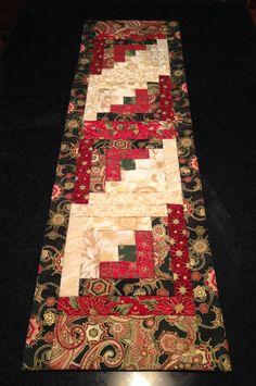 a table runner made out of different fabrics