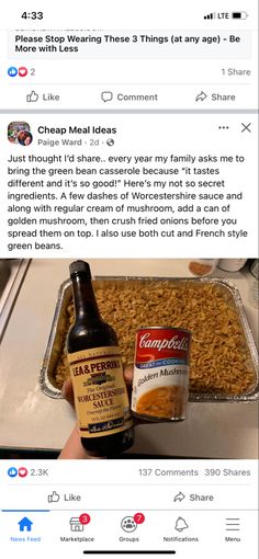 a bottle of beer sitting on top of a pan filled with food