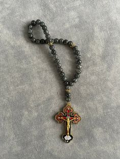 a rosary with an ornate cross on it