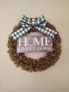 a wreath with the words home sweet home on it