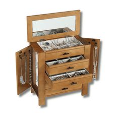 a wooden jewelry box with three drawers