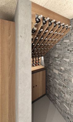 the wine rack is built into the stone wall