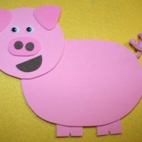 a pink paper cut out of a pig