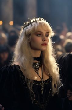 a woman with long blonde hair and a crown on her head is standing in front of a crowd