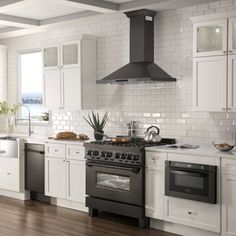 a stove top oven sitting inside of a kitchen