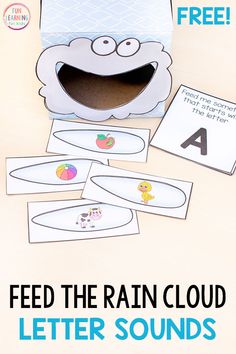 an open box with the words feed the rain cloud and letter sounds