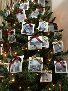 a christmas tree decorated with pictures and ribbons