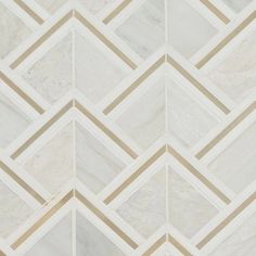 a white marble wall with gold lines on the bottom and diagonals in the middle