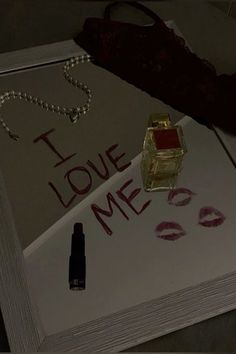 i love me written on a piece of paper next to lipstick