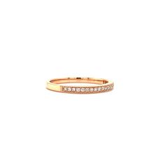 This beautiful and romantic ring is finely crafted in 14K rose gold. It features a row of 21 brilliant diamonds with a total carat weight of 0.14ct. The diamonds have been channel set. A polished finish and milgrain details have been included in this design to add elegance and texture. 14K Rose Gold Diamond: 21- Round-cut with a total carat weight of 0.14ct Polished Finish Milgrain Finger Size: 6.75 Classic Rose Gold Half Eternity Stackable Rings, Classic 14k Rose Gold Ring With Diamond Accents, Classic Rose Gold Diamond Stackable Rings, Formal 14k Rose Gold Diamond Ring With Accents, Rose Gold Half Eternity Diamond Ring, Classic Rose Gold Half Eternity Band, 14k Rose Gold Diamond Ring For Formal Events, 14k Rose Gold Half Eternity Ring, Classic Rose Gold Eternity Band With Diamond Accents