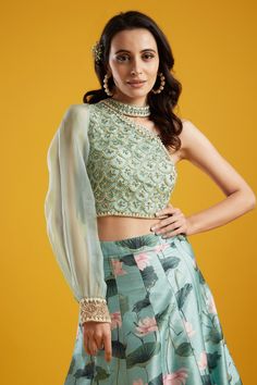 Editor's Note This set features a kali lehenga with one shoulder blouse. Color: Aqua Fabric: Net; Organza; Raw Silk Care: Dry Clean Only About the Designer Aayushi Maniar label was founded in the year 2016. The brand defines luxury with comfort and modern design philosophy. Her styles comprise fashion-forward statement pieces like Cape tops, Pre draped sarees, Lehengas and Anarkalis. The aim is to keep traditional aspects with a fresh and renewed perspective that is perfect for a modern woman, a Kali Lehenga, Printed Lehenga, Cape Tops, Aqua Fabric, Drape Saree, Color Aqua, Embroidered Blouse, Raw Silk, Set For Women