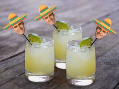 three glasses with limeade and two straw hats on them