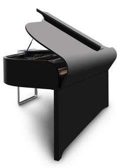 a black piano sitting on top of a white floor