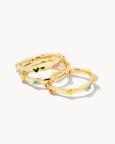 “Who doesn’t love hearts? They’re simultaneously fun and classic, and when paired with colorful, hand painted enamel, they become irresistible. I promise this trio will brighten your day as much as your outfit.” - Kendra Wear this set as a stack, or gift one (or two) to your besties. The Haven Heart Gold Ring Set of 3 in Multi Mix is both colorful and charming, each band encircled with hand painted hearts. Size - 0.3" stacked Please note: Due to the one-of-a-kind nature of the medium, exact colo Kendra Scott Rings, Preppy Ring, Trending Rings, Become Irresistible, Preppy Jewelry, Gold Heart Ring, Painted Hearts, Jewelry Accessories Ideas, Gold Ring Sets