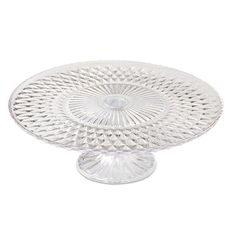 a clear glass cake plate on a white background