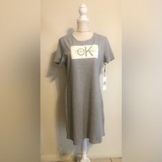 Calvin Klein Sport Dress Gray And White Color Brand New. Calvin Klein Fitted Casual Midi Dress, Casual Knee-length Calvin Klein Dress, Casual Calvin Klein Knee-length Midi Dress, Casual Calvin Klein Knee-length Dress, Casual Calvin Klein Midi Length Dresses, Casual Calvin Klein Midi Dress, Calvin Klein Casual Midi Dress, Spring Calvin Klein Mini Dress With Short Sleeves, Calvin Klein Short Sleeve Mini Dress For Spring