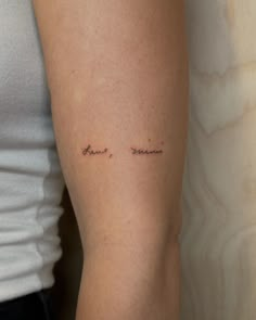 a woman with a small tattoo on her arm