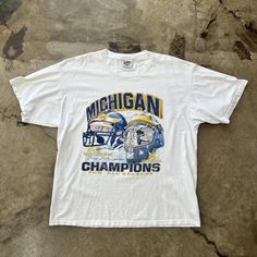 NCAA 1998 Michigan Champions Tee  Vintage Graphic tees  Shirt Outfit Idea Easy 30 day return policy 90s Style White T-shirt For College, 90s Style White T-shirt, 90s Crew Neck T-shirt For Fan Gear, 90s Style T-shirt For Fan Gear With Crew Neck, 90s Graphic Print T-shirt For Fan Gear, 90s Style Crew Neck T-shirt For Fan Gear, 90s Style Graphic Print T-shirt For Fans, Vintage White T-shirt For Fan Gear, 90s Style Screen Print T-shirt For Sports Events