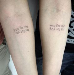 two people with tattoos on their arms that say you for me and not to us