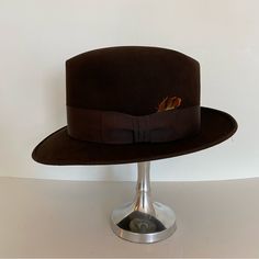 Dark Brown Felt Fedora With Matching Ribbon And Feather. Great Preowned Condition. No Size Tag But Is A 7. Inside Measures 21-7/8" Stetson Fedora, Felt Fedora, Colorful Feathers, Fedora Hat, Size Tag, Fedora, Dark Brown, Accessories Hats, Mens Accessories