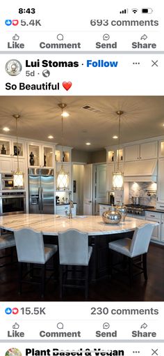 an image of a large kitchen with white cabinets and marble counter tops on instagram