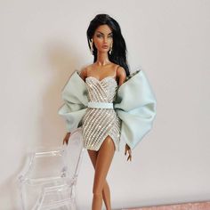 a barbie doll wearing a dress and heels